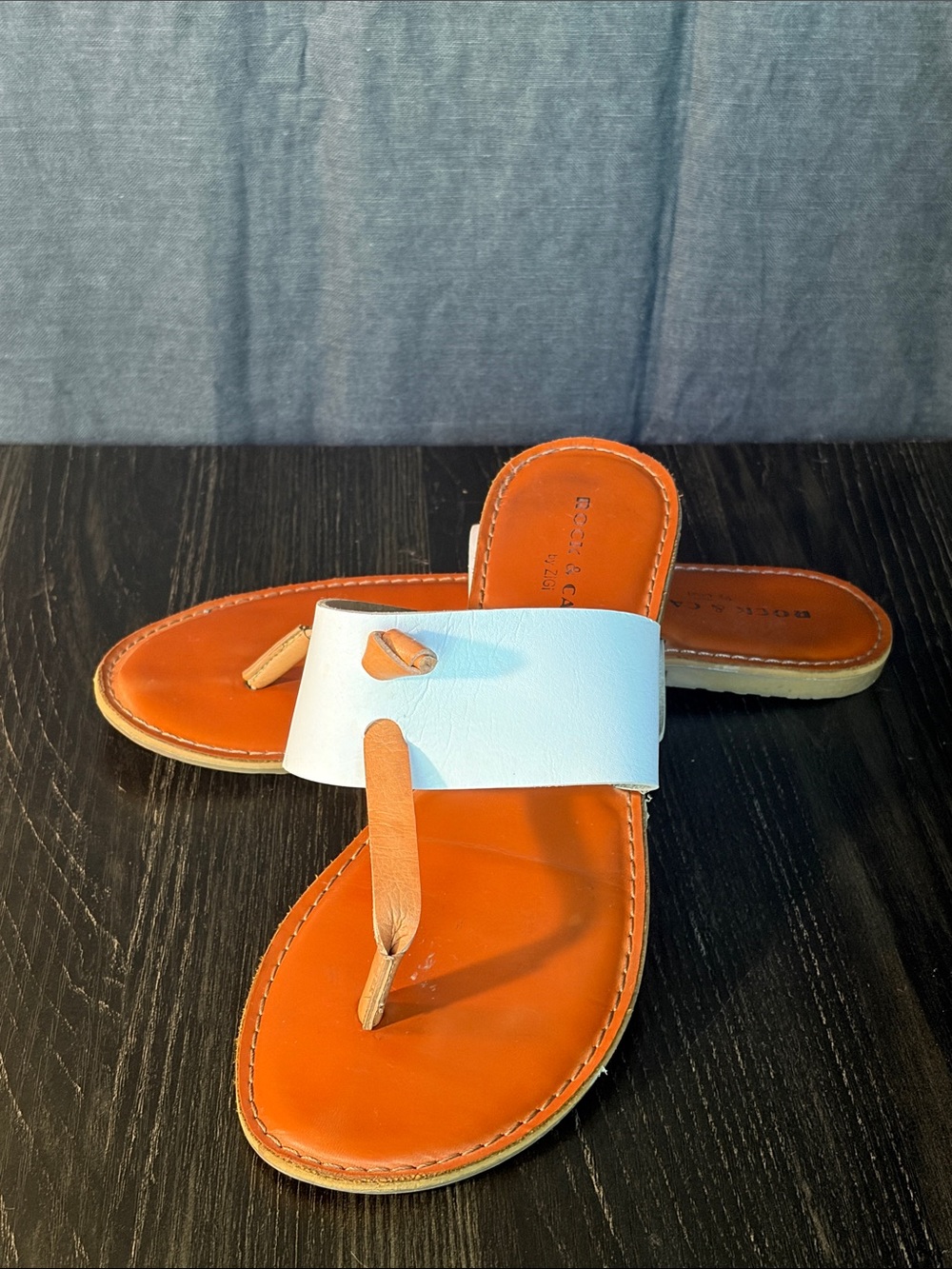 Rock & Candy White Strap Orange Footbed Toe-Post Sandals